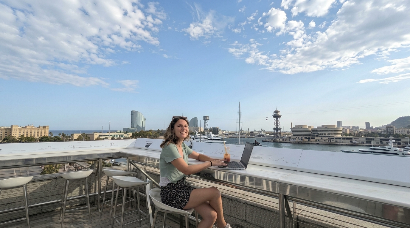 Celine working on her laptop in Barcelona